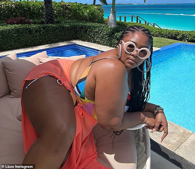 Enjoying paradise: The Detroit-born and Houston-raised musician shared snaps and a clip of herself posing and dancing poolside