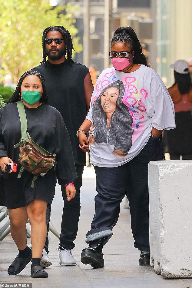 Looking Good As Hell! Lizzo seemed to be feeling confident as she donned a T-shirt with a picture of herself while out with boyfriend Myke Wright in New York City on Monday