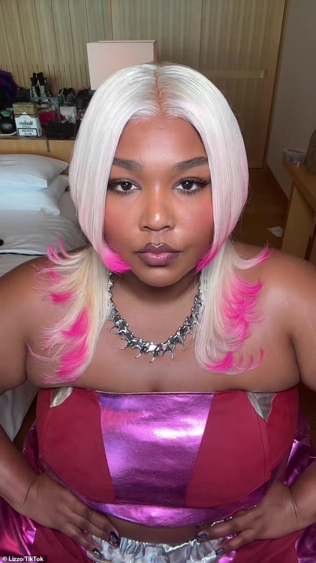 New hair: Lizzo, 35, shared glamorous snaps from her trip to Tokyo, Japan on Wednesday, where she showed off her new jellyfish-inspired wig with dyed H๏τ pink tips