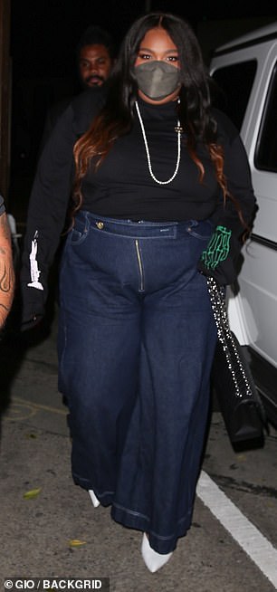 Back in black: Lizzo paired her high-waisted pants with a simple black shirt