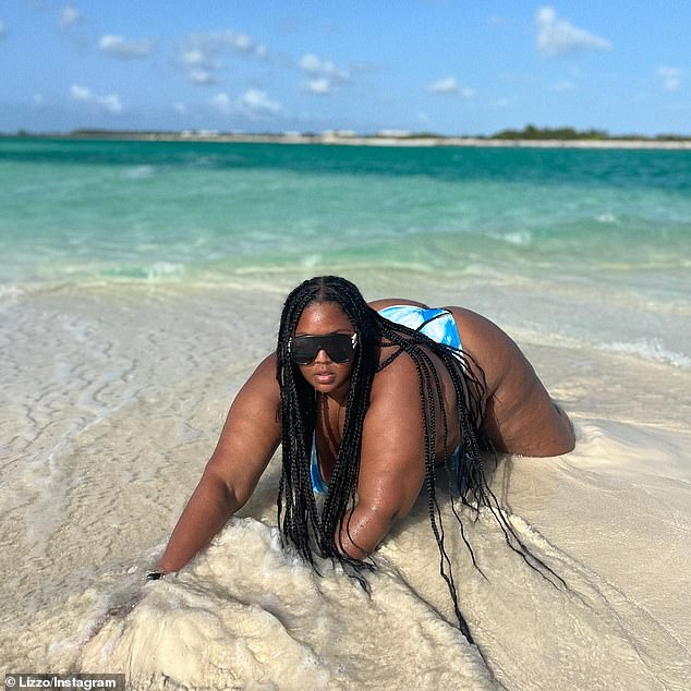 Fun in the sun: Lizzo shared several pH๏τos and a video that were taken during a trip to what she described as the 'middle of the ocean' to her Instagram account on Wednesday