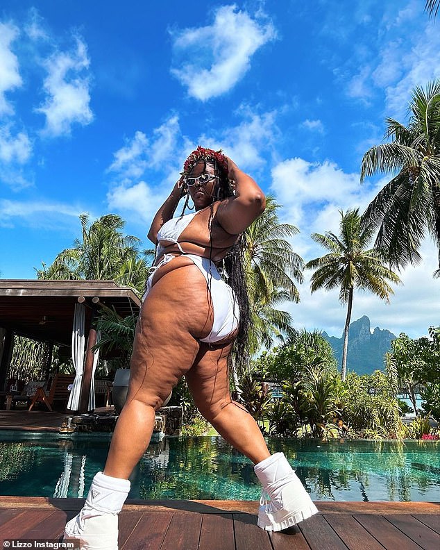 Curvy and proud: Lizzo posed for a playful ʙικιɴι pH๏τo shoot in a beautiful tropical location on Tuesday afternoon