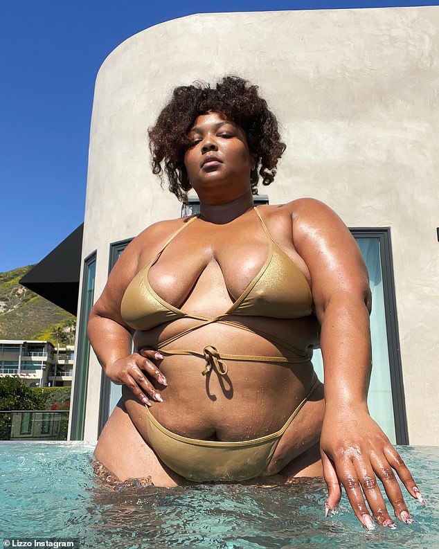 Golden: Lizzo appeared on Instagram in nothing but a shimmering gold ʙικιɴι on Monday