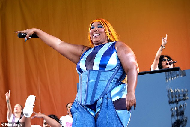 Double denim: Lizzo, 35, looked dazzling at the annual New Orleans Jazz & Heritage Festival in Louisiana on Friday