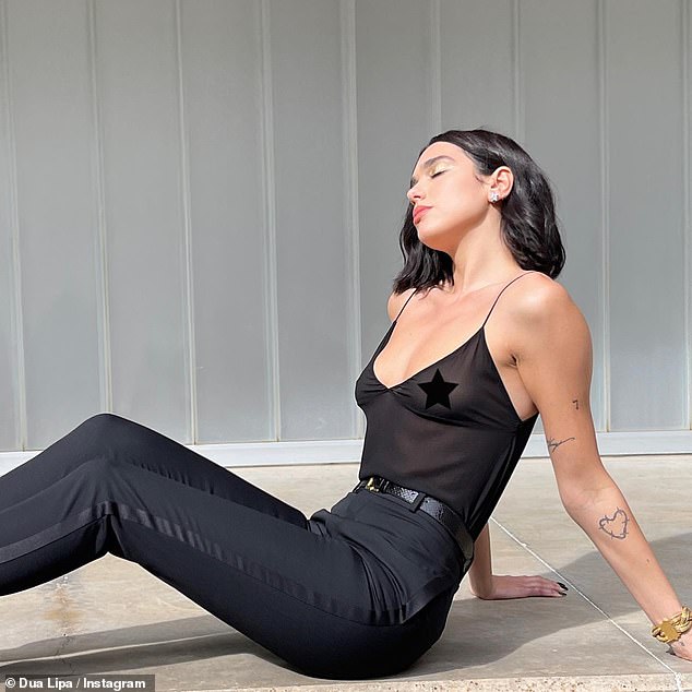 Dua Lipa showcases her incredible figure in black sheer crop top as she poses for YSL pH๏τoshoot | Daily Mail Online