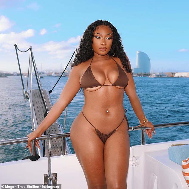 Sєxy: The 27-year-old rap star flashed her underboob and pert derriere as she posed aboard a yacht in Barcelona, Spain