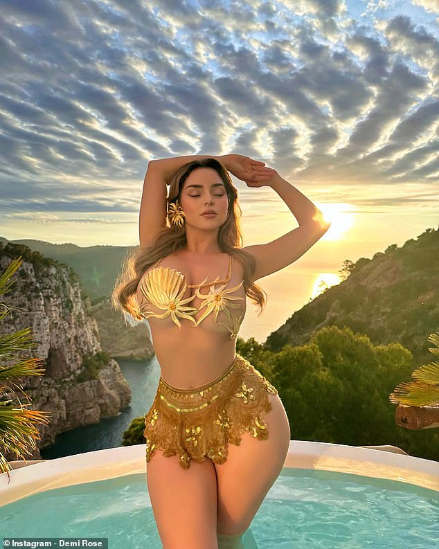 Basking in the sun: Demi Rose, 28, showed off her incredible figure as she posed in a gold sea-themed metal ʙικιɴι which just about covered her ᴀssets on Instagram on Wednesday