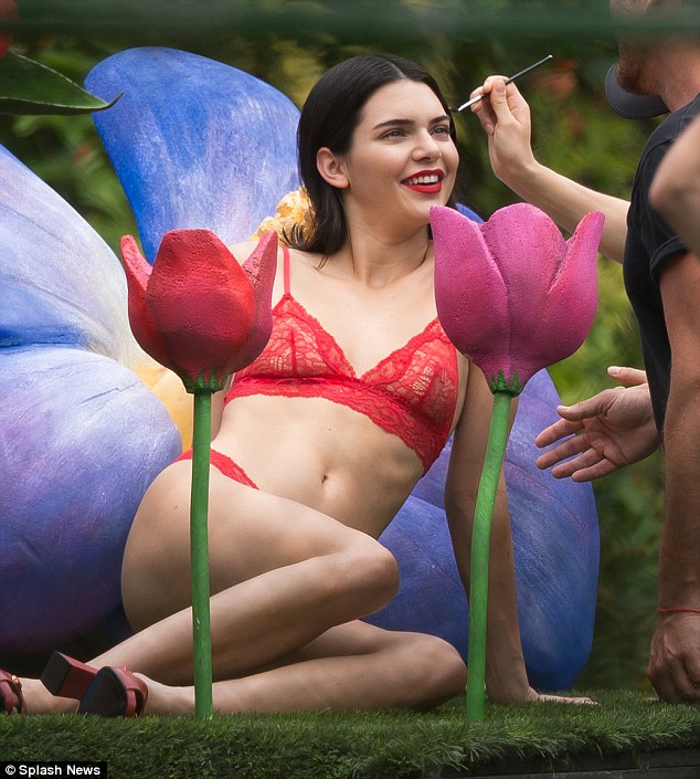 A blossom: Kendall Jenner posed with fake flowers during a shoot in Miami on Sunday