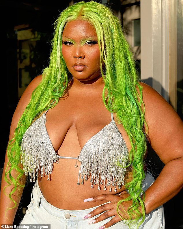 Making it happen: Lizzo was at it again this weekend as she flaunted her curves in a metallic bra that was dripping with glittering fringe