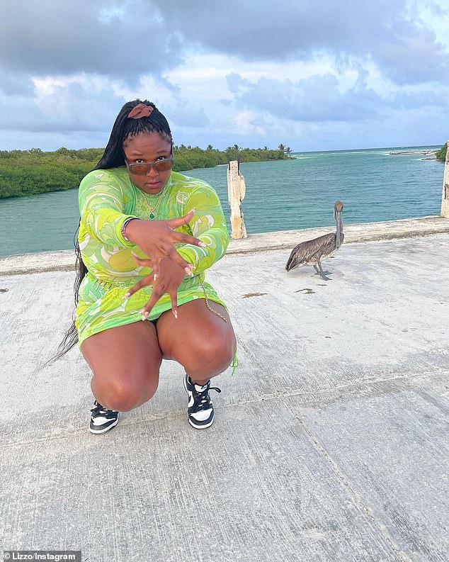 Fun in the sun: Lizzo has worn pieces from Doja Cat's PrettyLittleThing range several times, including a floral green number while celebrating her birthday at the start of May