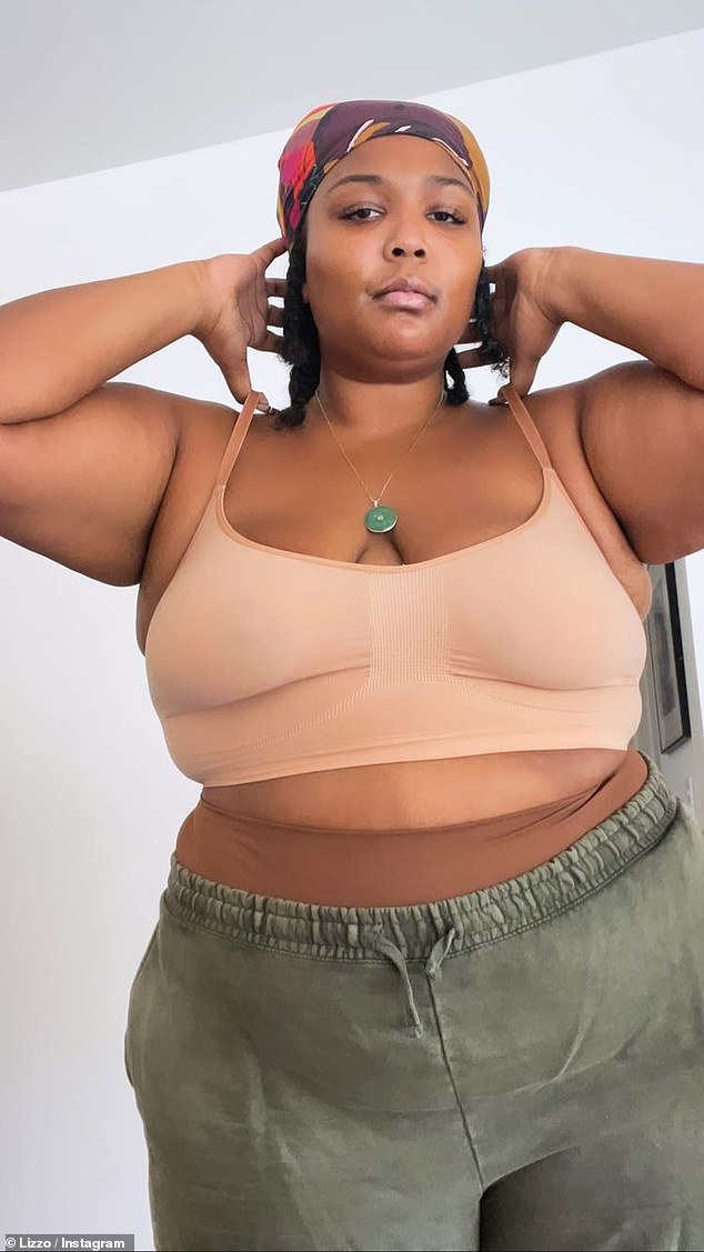 Daring: Lizzo went braless under a ɴuᴅᴇ crop top and sweat pants as she admitted 'this year she's got to pick herself up from a new low' in motivational post on Instagram on Monday