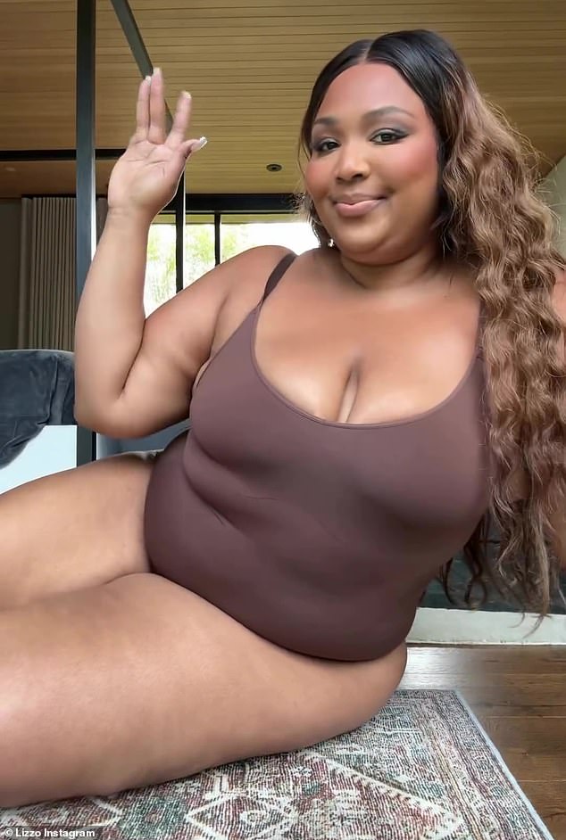 Lizzo let loose with some big feelings in a video chat with her fans on social media Tuesday. The singer, 36, wore one of her Yitty brand's brown Nearly Naked bodysuits for a 'nearly naked talk'