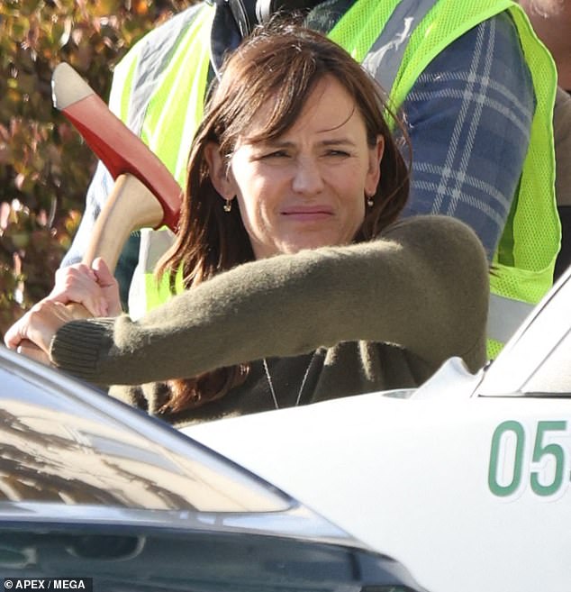 Jennifer Garner, 52, swung an ax as she filmed a tense scene for the upcoming second season of the Apple TV+ series, The Last Thing He Told Me