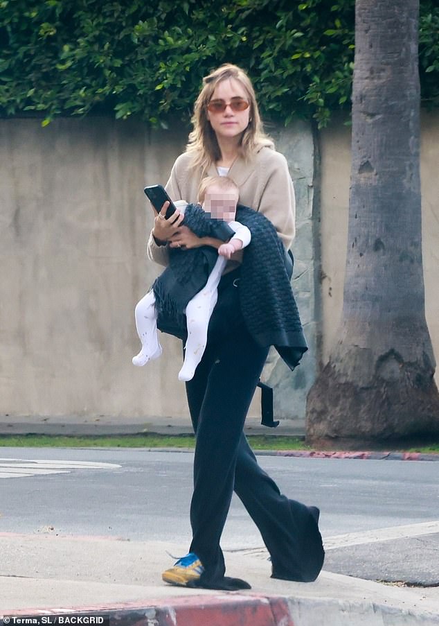 Suki Waterhouse enjoyed bonding time with her eight-month-old baby daughter while out on a walk in Los Angeles on Sunday