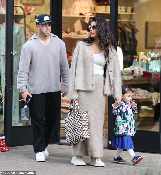 Nick Jonas, 32, and Priyanka Chopra, 42,  looked cozy as they stepped out to do some holiday shopping with their daughter Malti, almost three, on Monday in Los Angeles